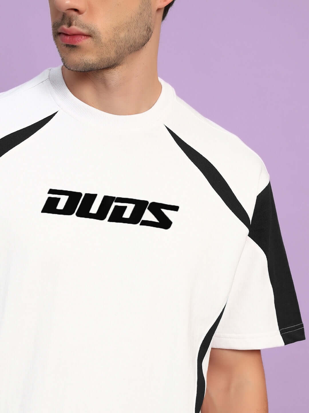 CANDOR OVER-SIZED T-SHIRT WHITE BLACK with bold black detailing on the front, perfect for streetwear enthusiasts.