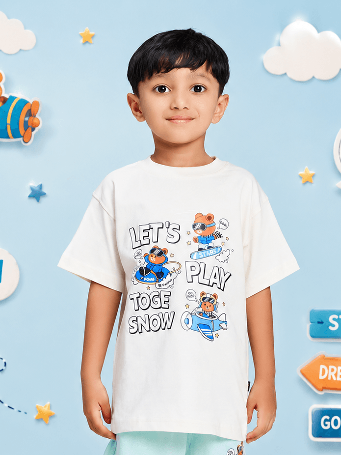 CARTOON BEAR T-SHIRT FOR BOYS GIRLS WHITE worn by a boy smiling, featuring playful cartoon design on a white background.