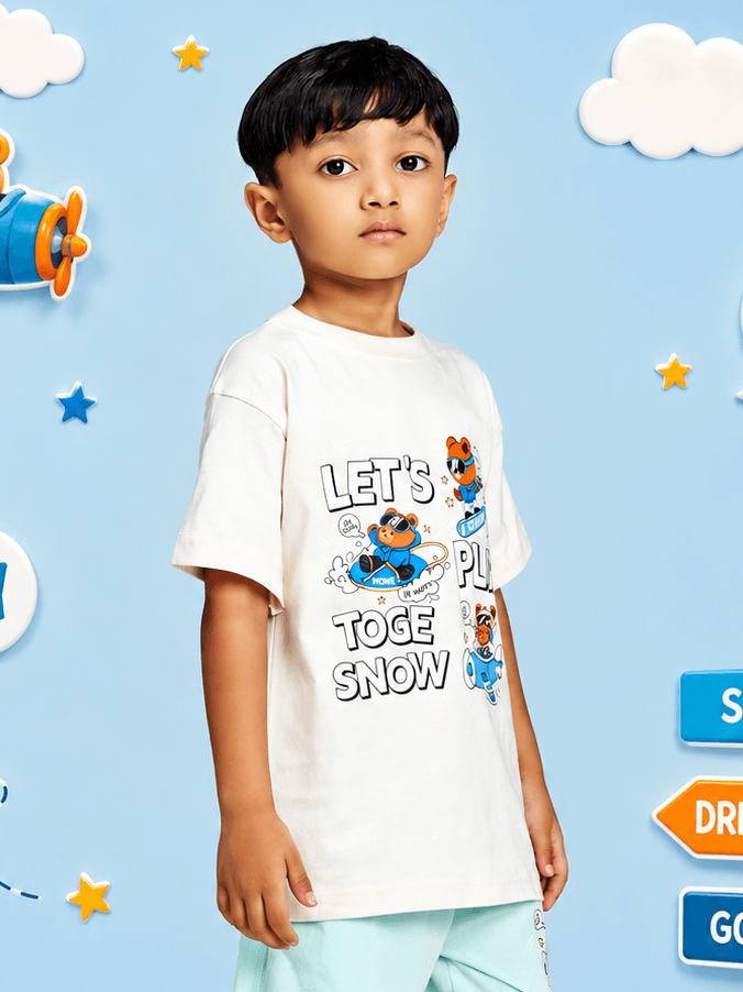 CARTOON BEAR T-SHIRT FOR BOYS GIRLS WHITE worn by a boy against a playful blue background.