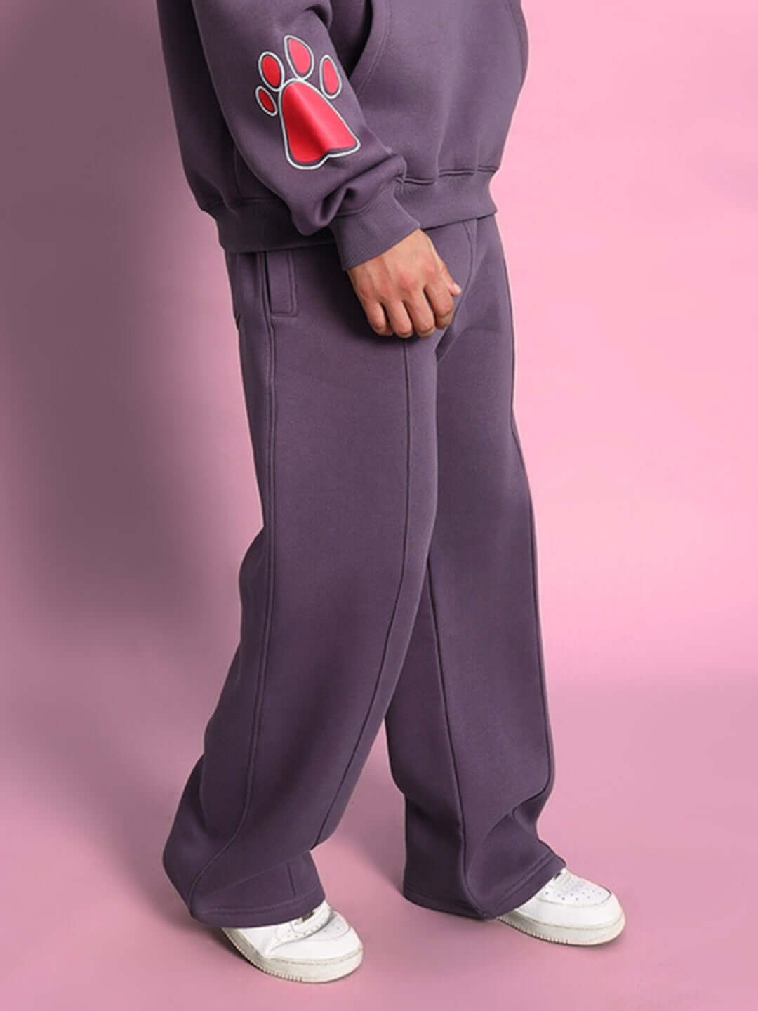 Casper Cotton Fleece Jogger in Violet with paw print design, shown on person against pink background, showcasing casual stylish fit.