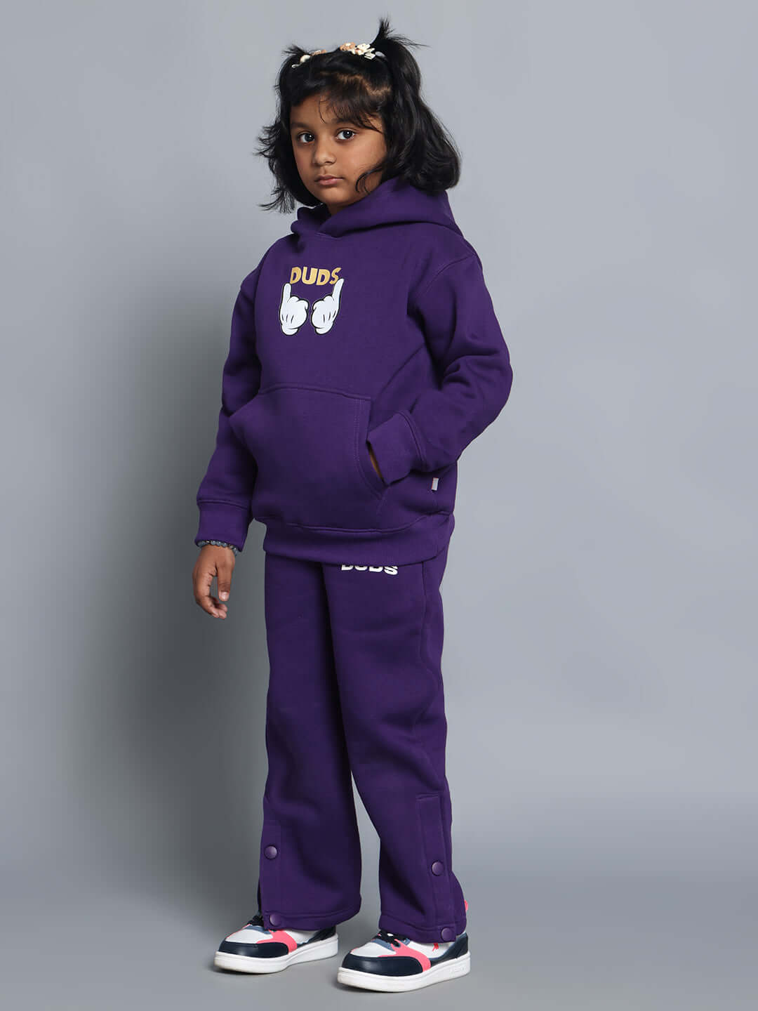 Child wearing CASPER FLEECE PANT FOR BOYS GIRLS PURPLE with matching hoodie, showcasing stylish and comfortable fashion for kids.