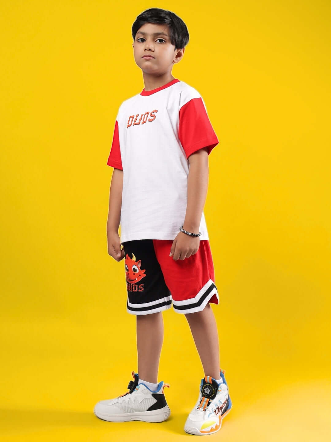 CASSIE CO-ORD FOR BOYS & GIRLS WHITE RED outfit modeled, trendy children's fashion attire.