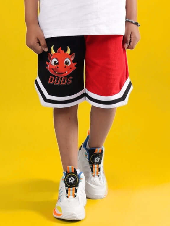 CASSIE SHORTS FOR BOYS & GIRLS BLACK-RED with cartoon face design, perfect for customizable fit, made by DUDS tailors, worn with sneakers.