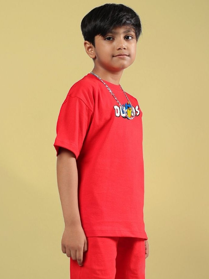 Child wearing CATCH THE WAVES T-SHIRT FOR BOYS GIRLS RED, showcasing vibrant red tee perfect for adventurous kids, premium cotton material.
