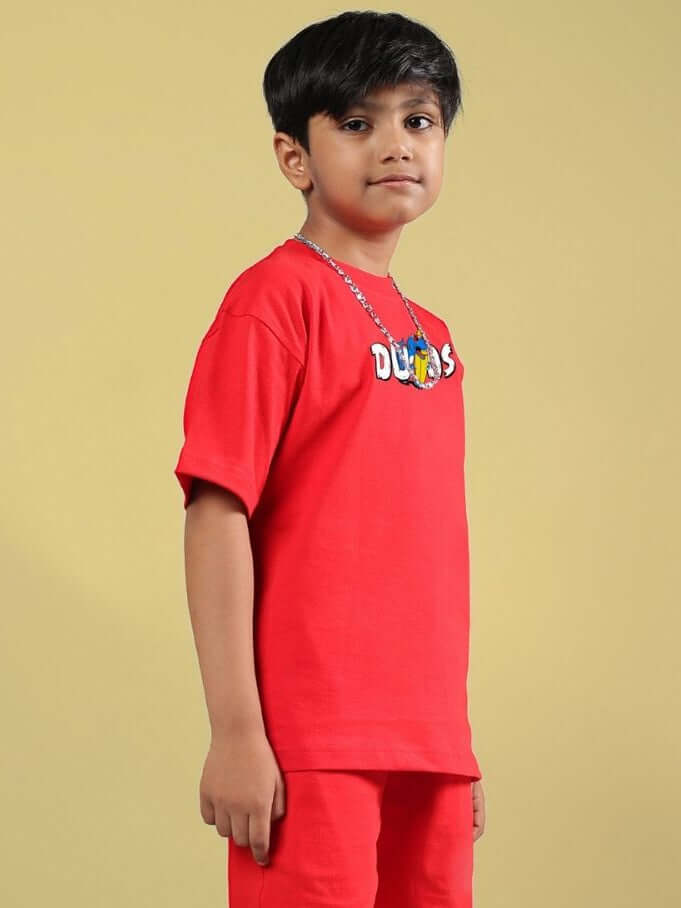 Boy wearing CATCH THE WAVES T-SHIRT FOR BOYS GIRLS RED, showcasing vibrant style ideal for adventurous kids.