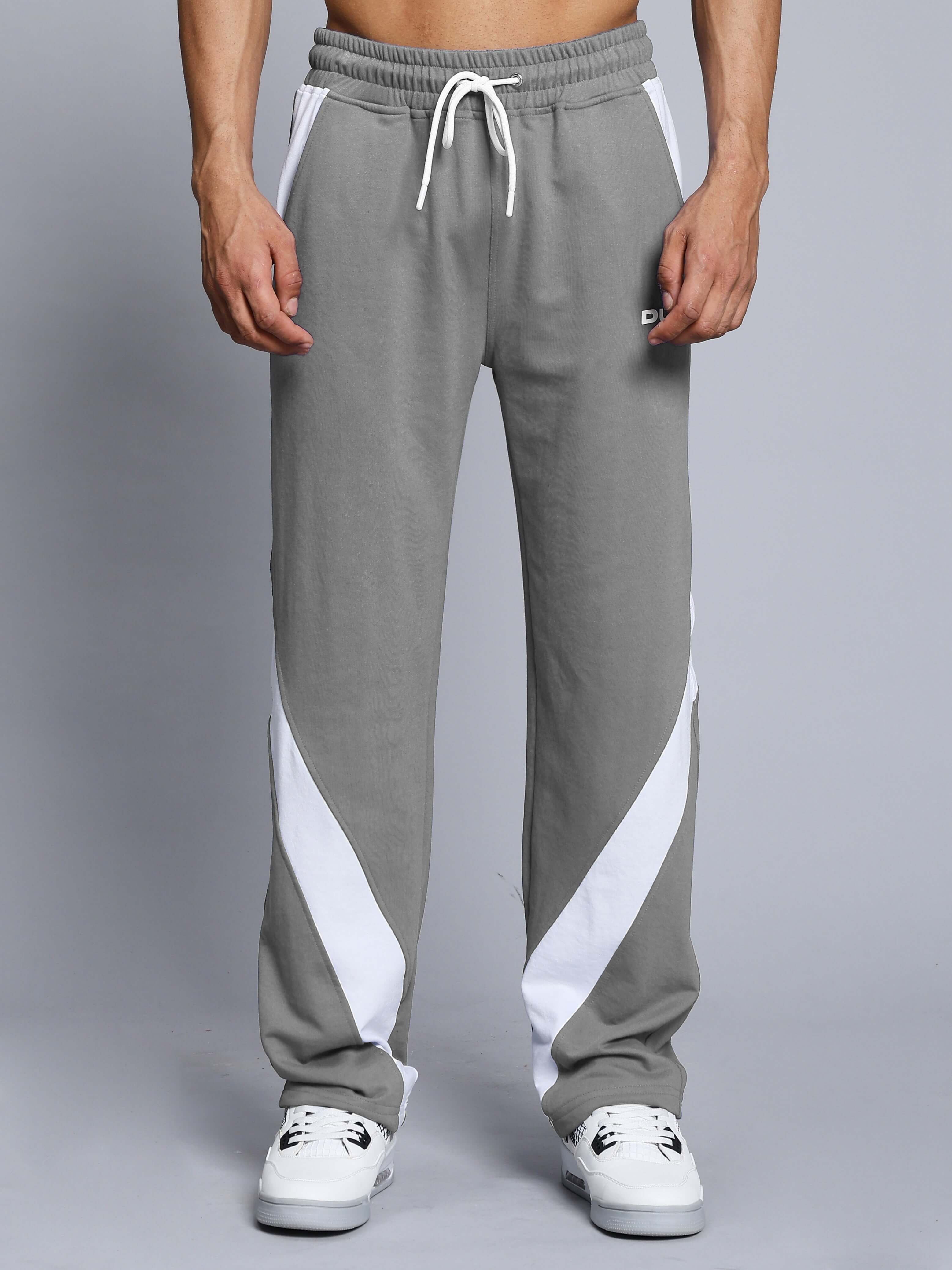 Person wearing Celestine Cool Relaxed Fit Jogger in grey and white, showcasing comfortable style with customizable size options.