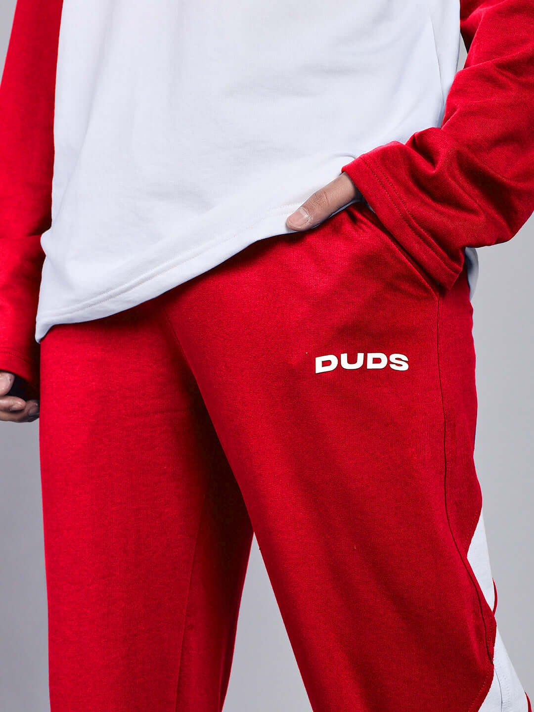 Person wearing red and white Celestine Cool Relaxed Fit Jogger from DUDS, showcasing comfortable and stylish design, made to order.