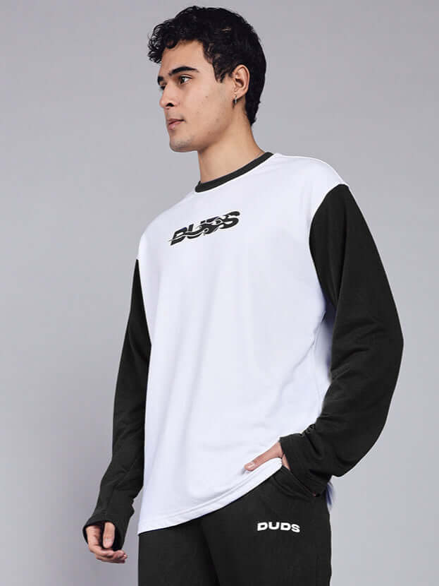 Man wearing CELESTINE Cool Sweatshirt in white and black, made from premium cotton fabric, showcasing a stylish casual look.
