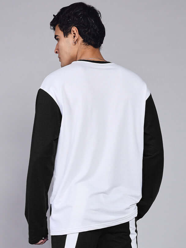 Back view of man wearing Celestine Cool Sweatshirt in white and black, made from premium cotton French terry and elastane.