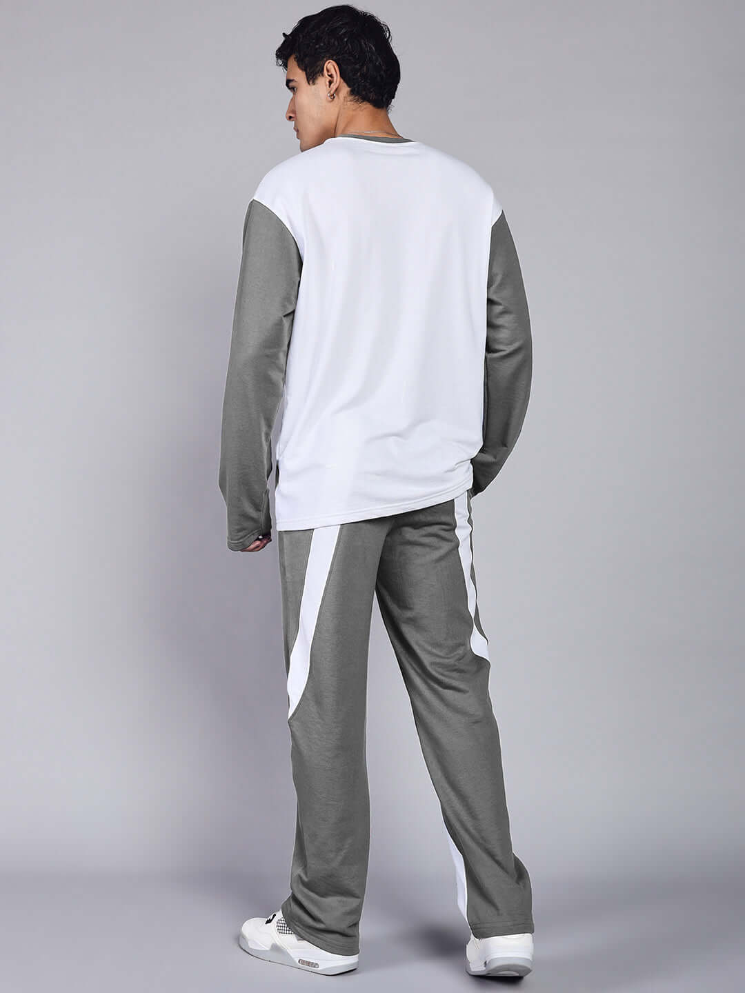 Back view of model wearing CELESTINE COOL RELAXED FIT CO-ORD SET WHITE GREY for effortless style and comfort