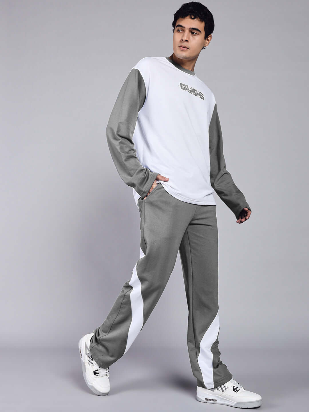 Model wearing CELESTINE COOL RELAXED FIT CO-ORD SET WHITE GREY, showcasing stylish white and grey outfit for women.