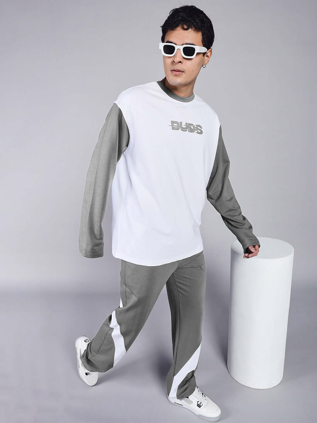 Man wearing CELESTINE COOL RELAXED FIT CO-ORD SET WHITE GREY with white sneakers.