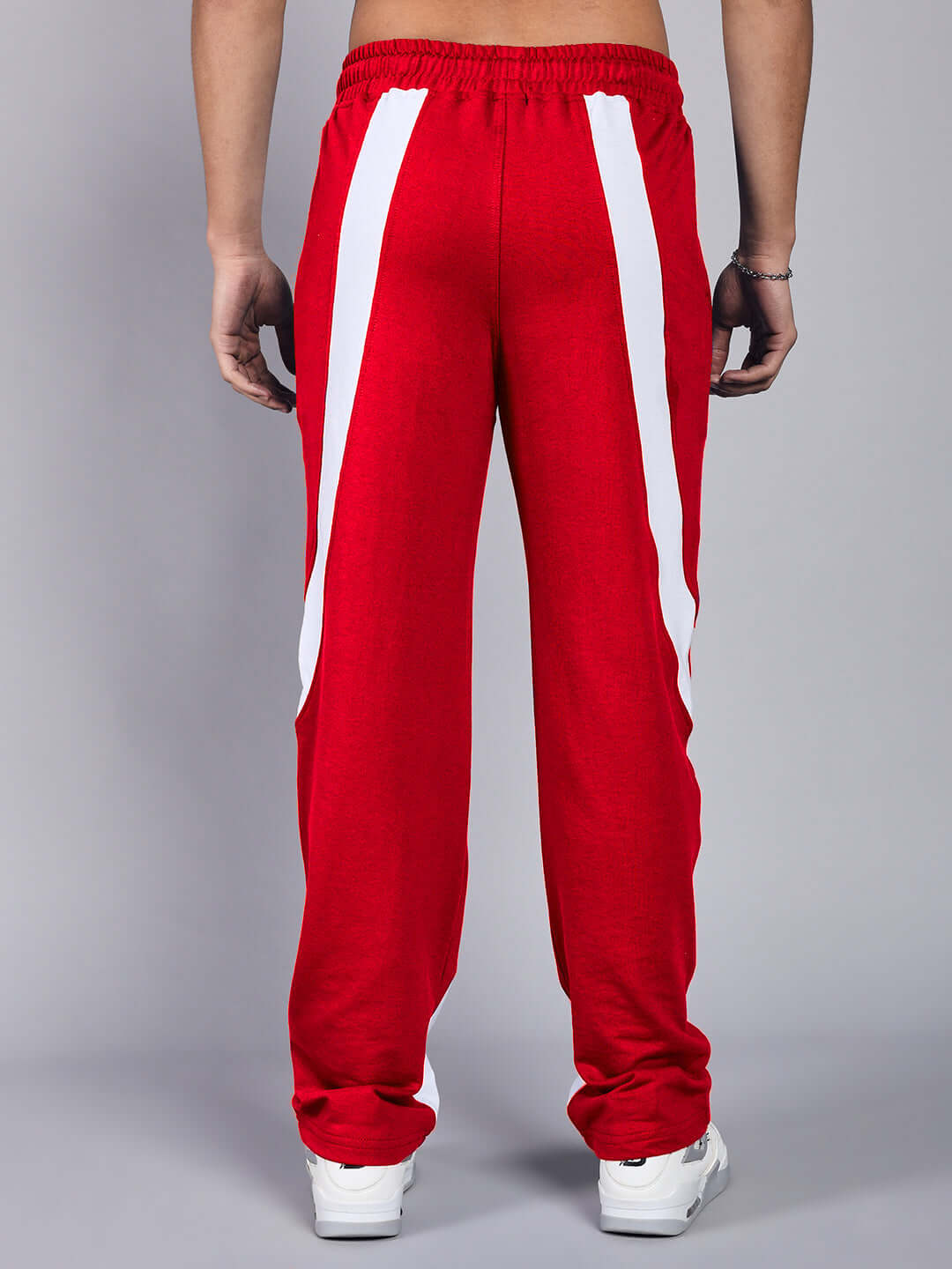 Back view of CELESTINE COOL RELAXED FIT CO-ORD SET WHITE RED pants with white accents on red fabric.