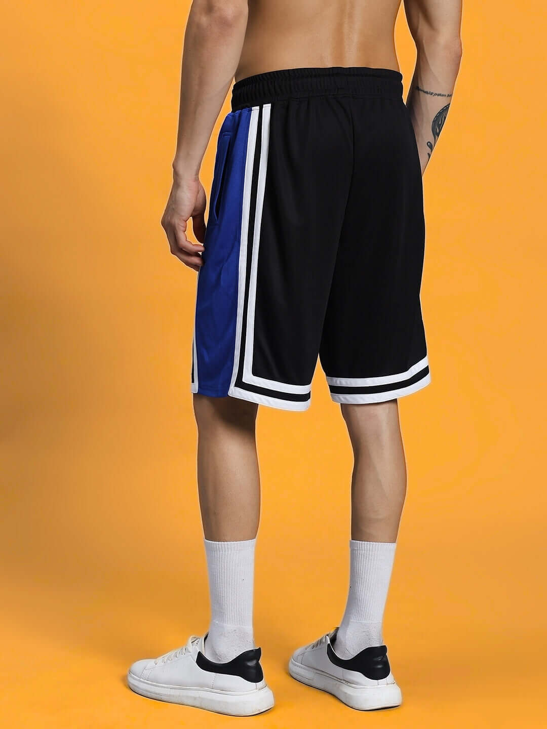 Back view of CHALLENGE REGULAR FIT SHORTS R BLUE for kids, showcasing style and comfort, ideal for active sports and everyday wear.