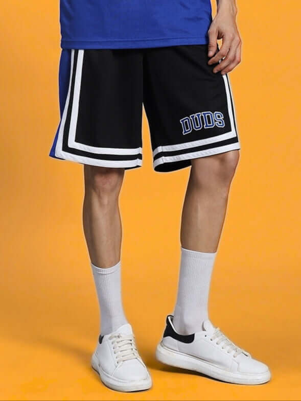 Unisex athletic shorts modeled with a blue shirt, emphasizing comfort, style, and versatility.