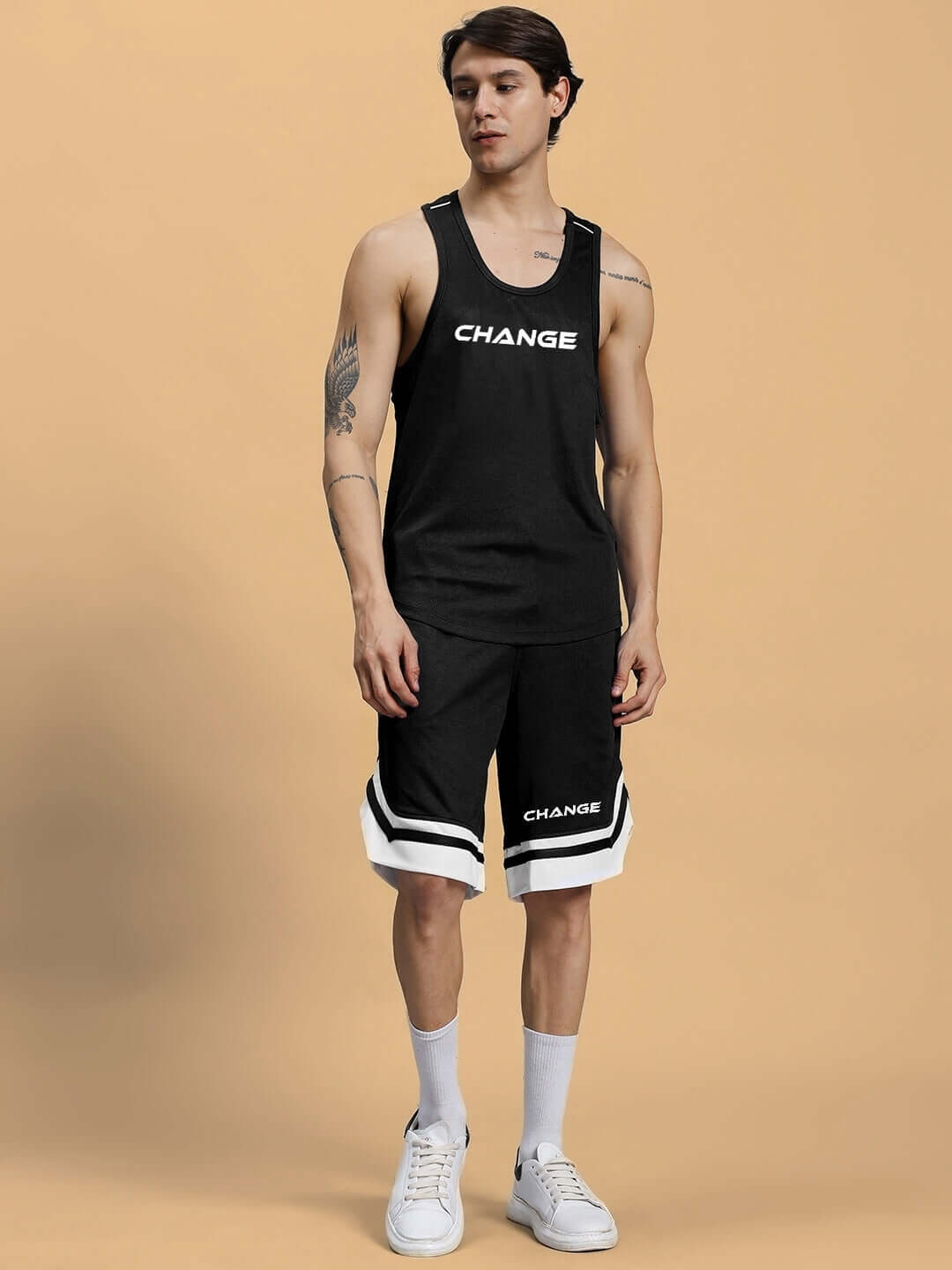 Man wearing CHANGE YOUR LOOKS GYM CO-ORD SET BLACK, showcasing stylish and comfortable fitness apparel.
