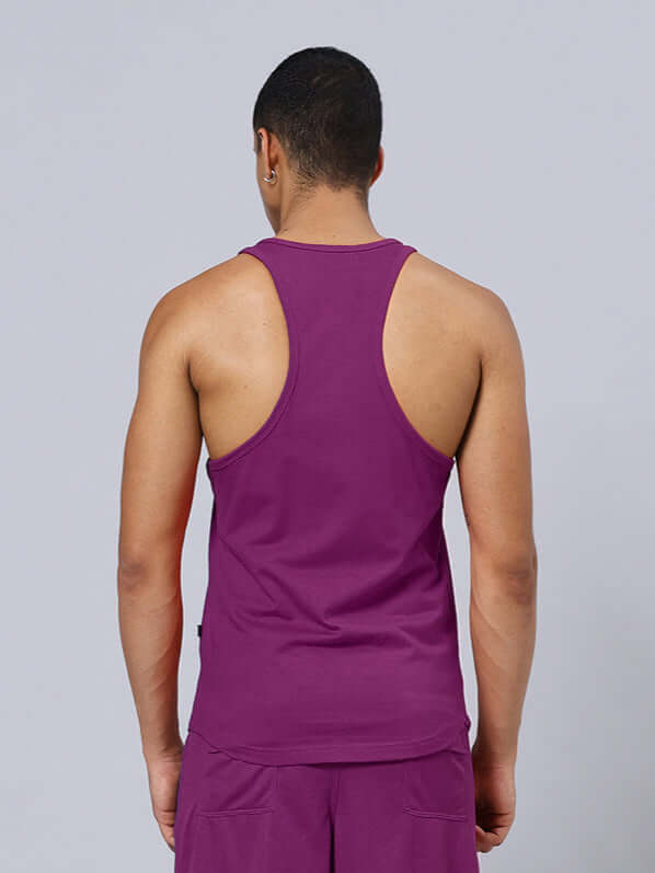 Back view of a person wearing a Chasing Bless Printed Gym T-Shirt in purple, showcasing the design and fit.