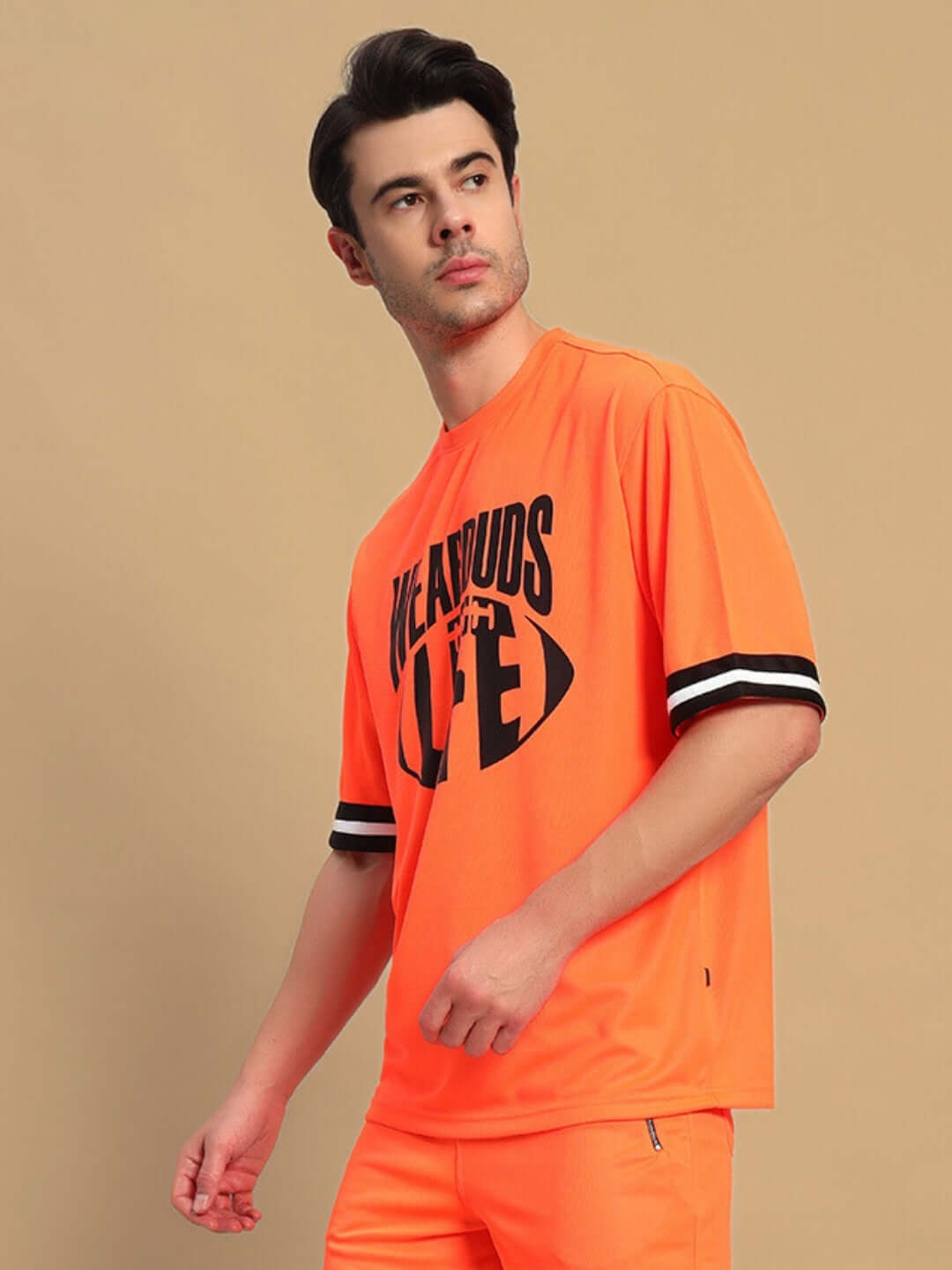 CHRONIC OVER-SIZED T-SHIRT ORANGE on man, vibrant unisex tee with graphic, casual street-inspired style, soft breathable fabric