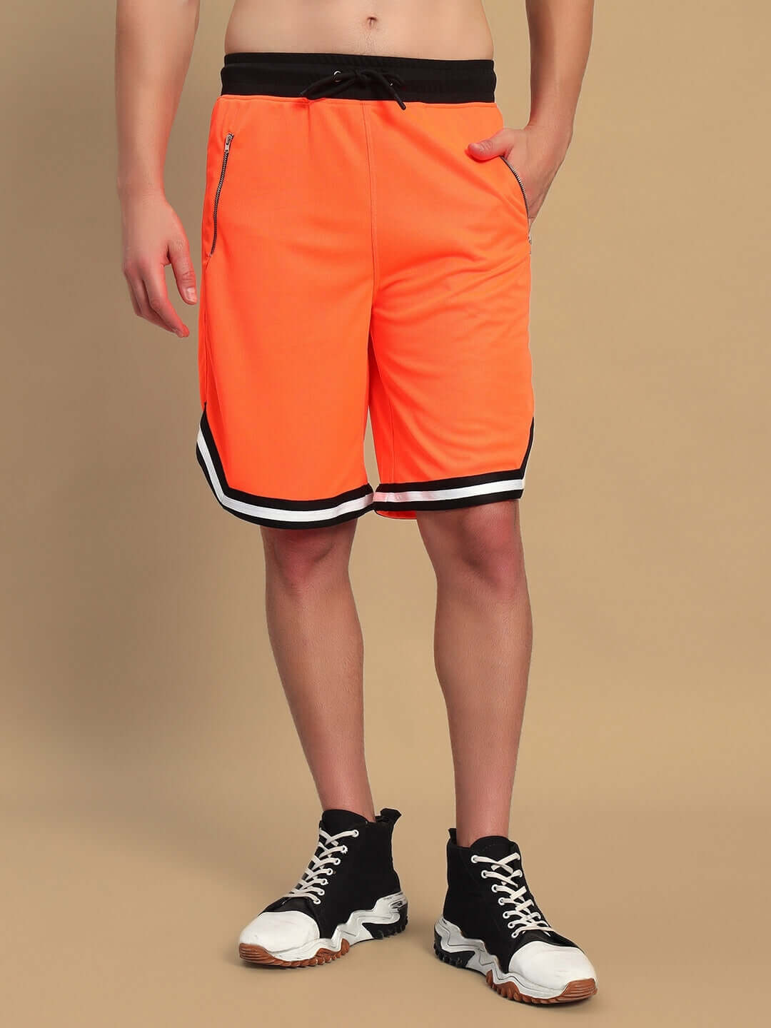 Person wearing CHRONIC REGULAR FIT SHORTS ORANGE with a bold design, perfect for casual wear.