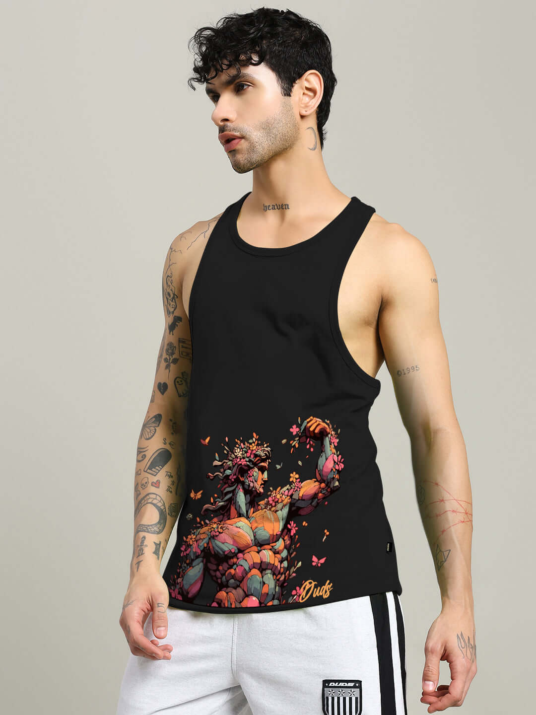 Model wearing a black Classical Greek Gym T-shirt with custom fit option, adorned with artistic Greek illustrations.