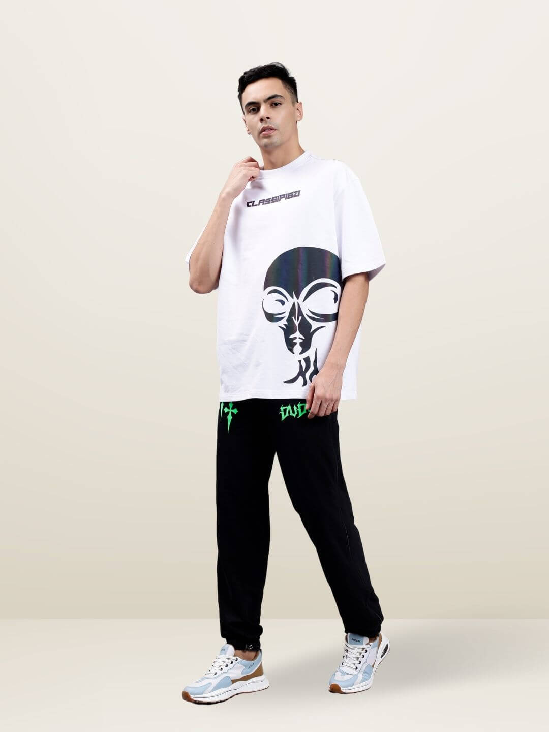 Model wearing Classified Reflector Oversized T-shirt in white, made from premium cotton with a French Terry blend, featuring a bold graphic design.