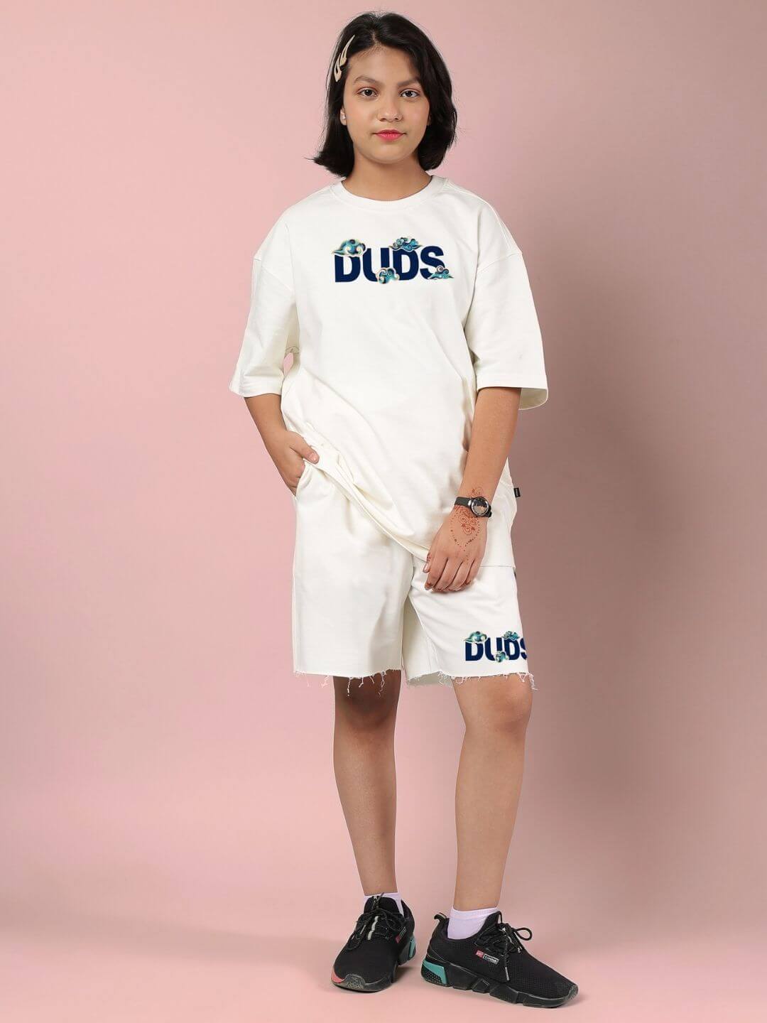 Child wearing CLOUD PRINTED CO-ORD FOR BOYS AND GIRLS OFF WHITE with cloud design, showcasing comfortable and trendy clothing for kids.