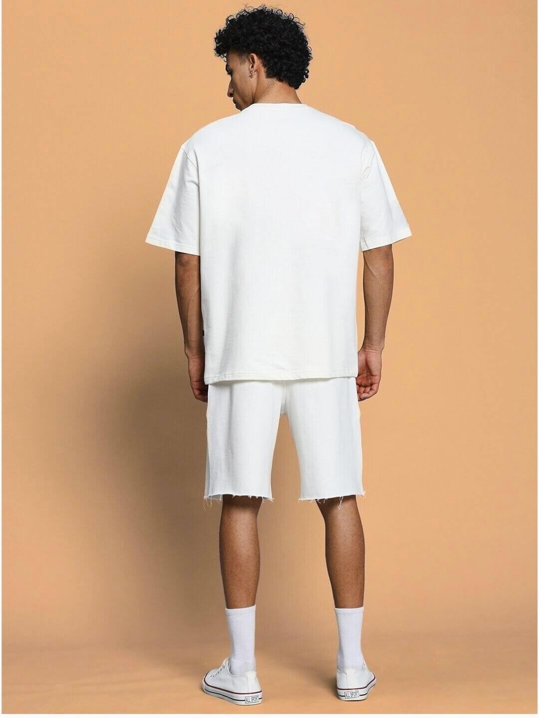Back view of model wearing CLOUD PRINTED CO-ORD SET OFF WHITE, showcasing chic design and soft off-white cloud print ensemble.