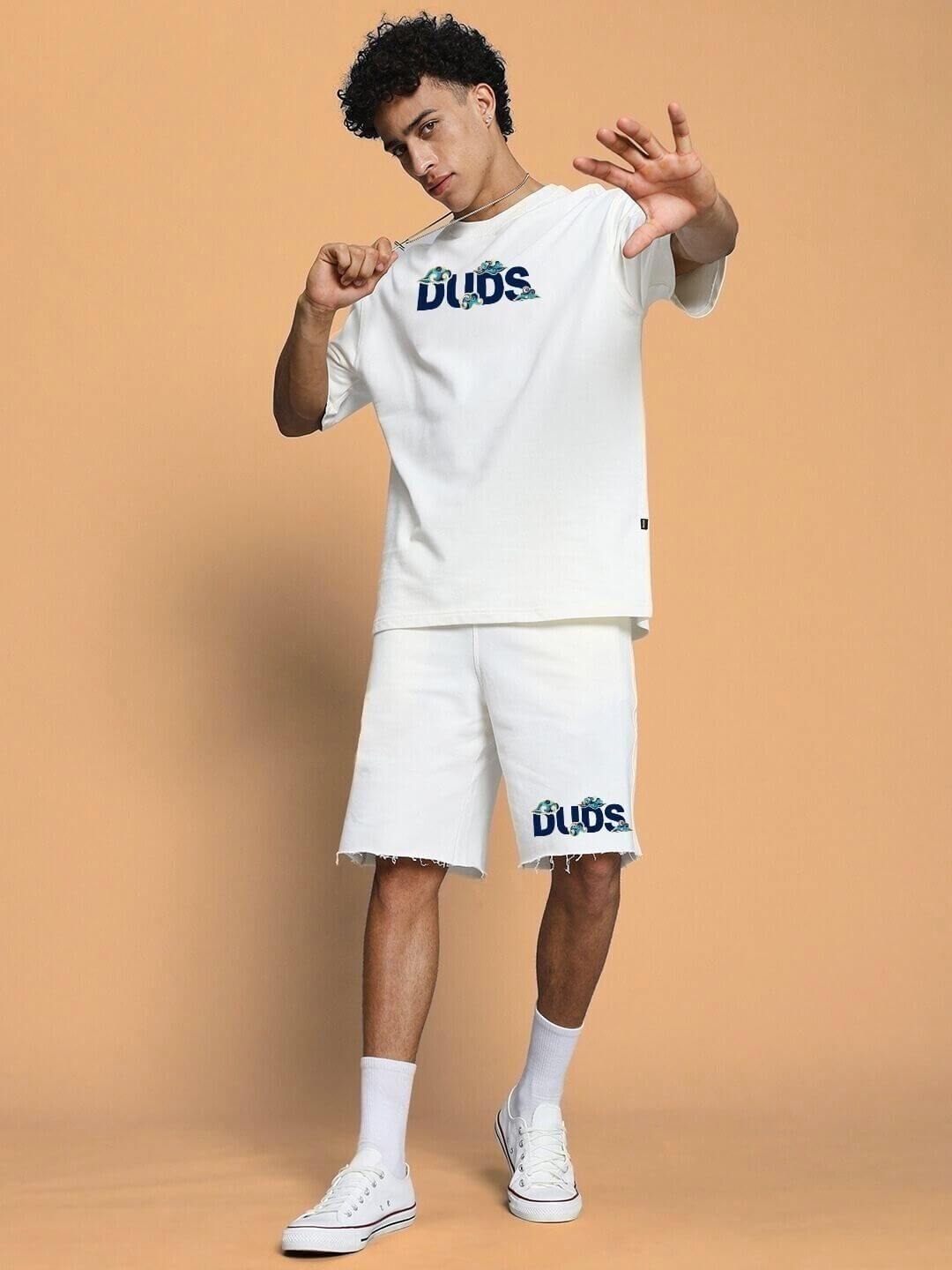 Man wearing CLOUD PRINTED CO-ORD SET OFF WHITE with cloud design, displaying modern street style flair.