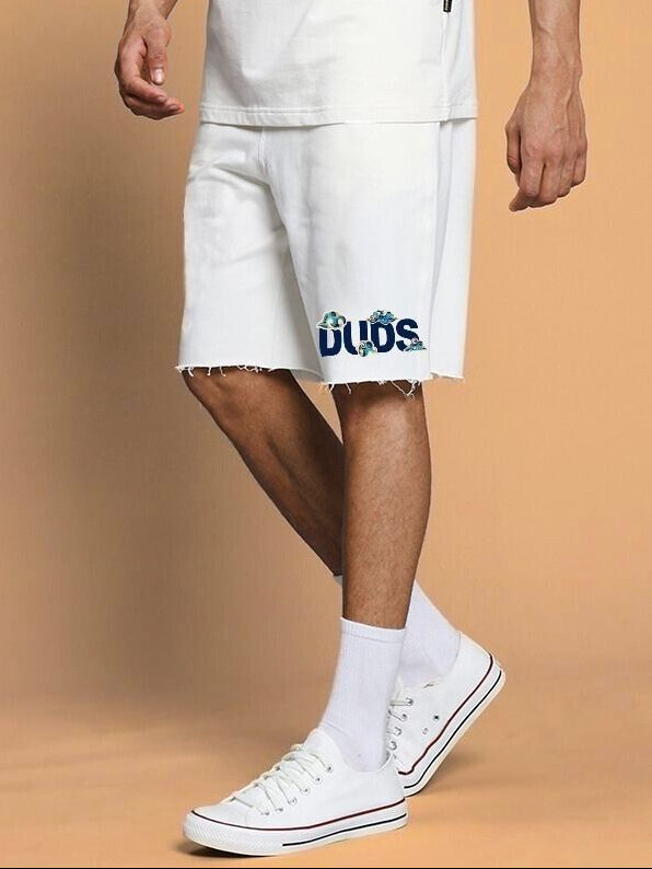 Model wearing CLOUD PRINTED RELAXED FIT SHORTS OFF WHITE with casual shoes, showcasing comfort and style.