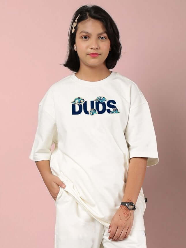 CLOUD PRINTED OVERSIZED T-SHIRT FOR BOYS AND GIRLS OFF WHITE, featuring a dreamy cloud pattern, worn by a child