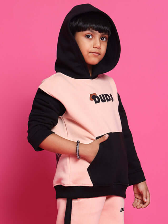 Child wearing a black-beige Club House co-ord with hoodie, featuring "DUDS" label on a pink background, suitable for boys and girls.