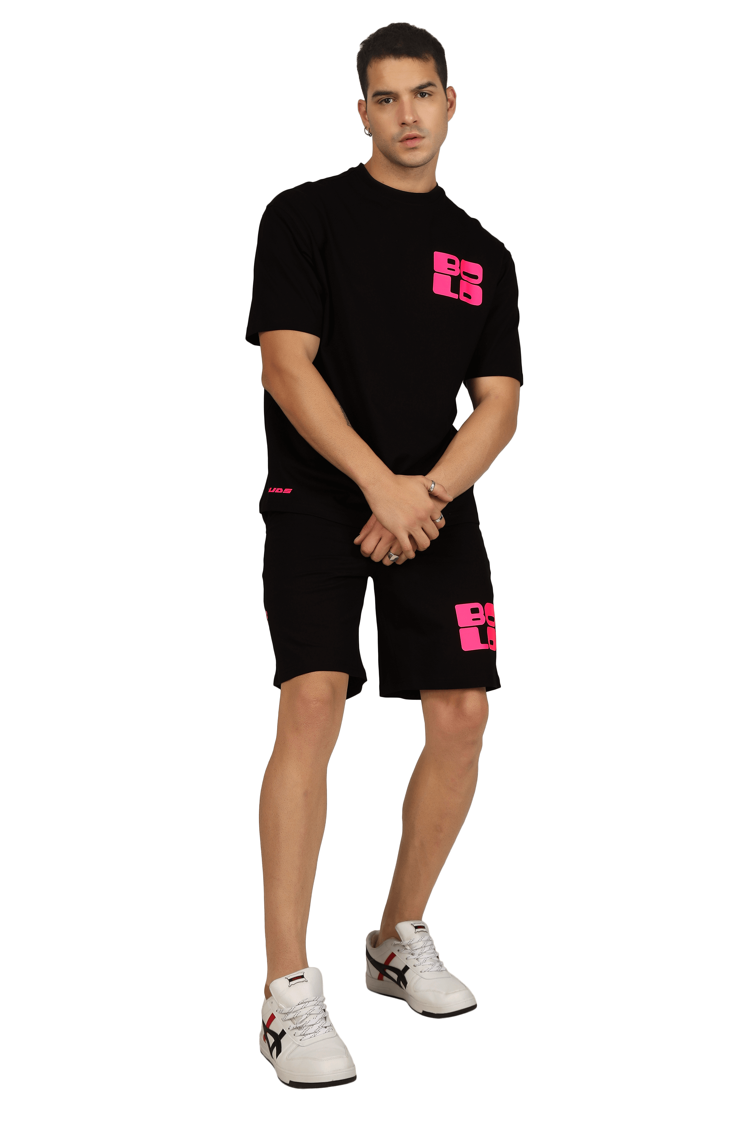 Man wearing black co-ord set with 'BOLD' print, featuring a t-shirt and shorts. Fashionable and customizable fit available.