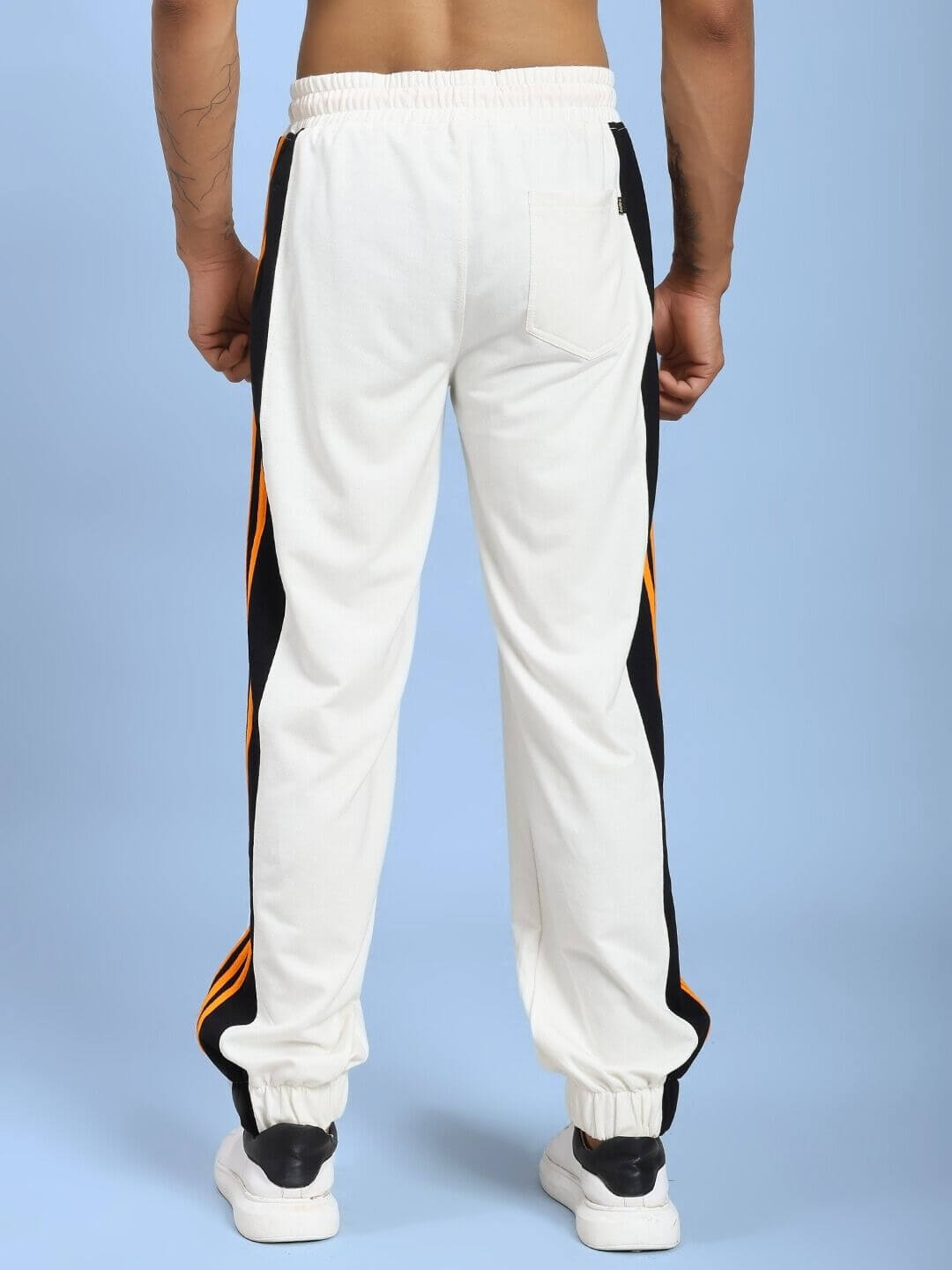 Back view of COMFORT FLEX STRIPE JOGGER OFF-WHITE with stripe design, showcasing casual elegance and comfortable fit for women.