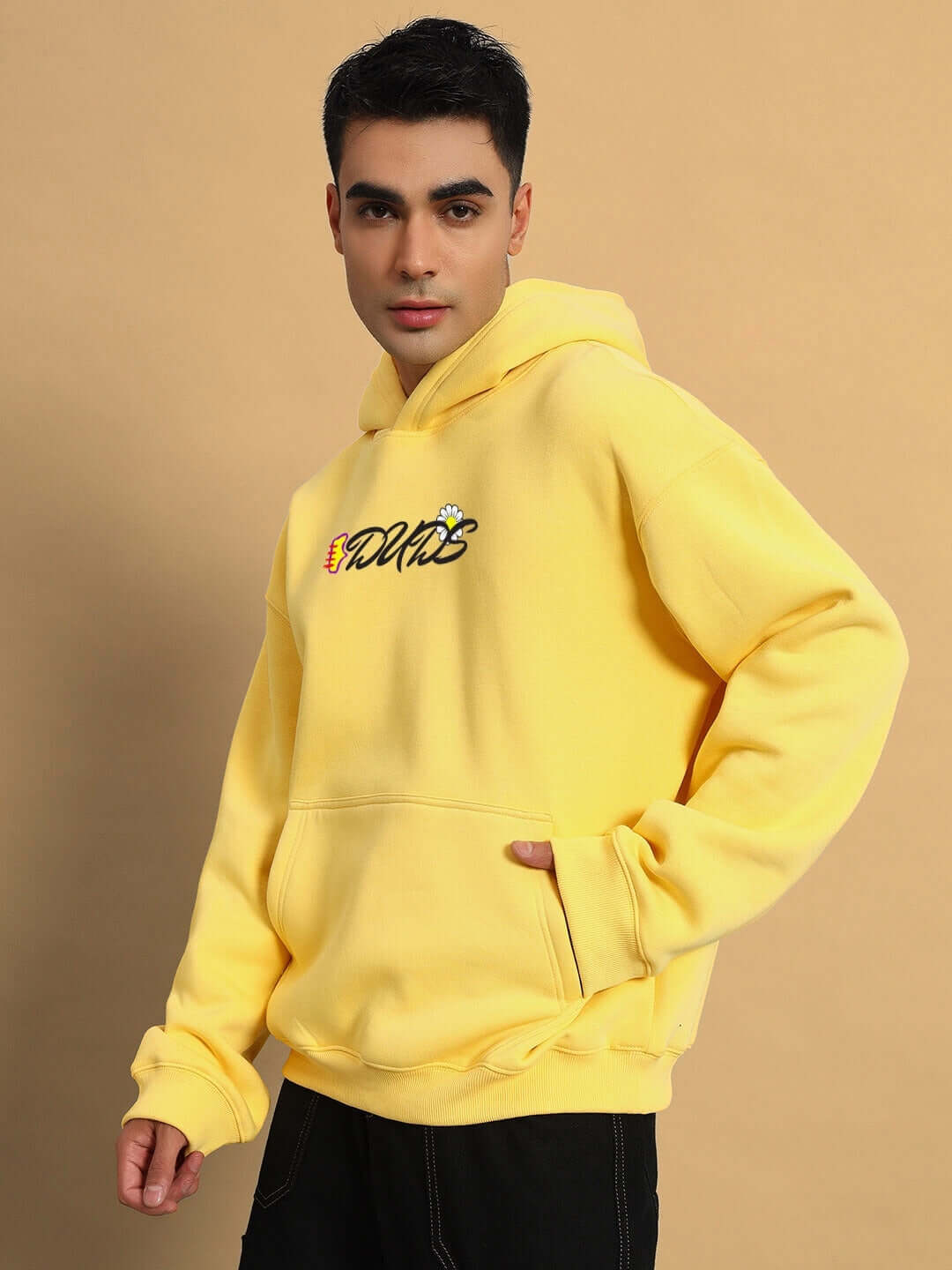 Person wearing CONFUSED FLEECE OVERSIZED HOODIE YELLOW showcasing a vibrant streetwear style.