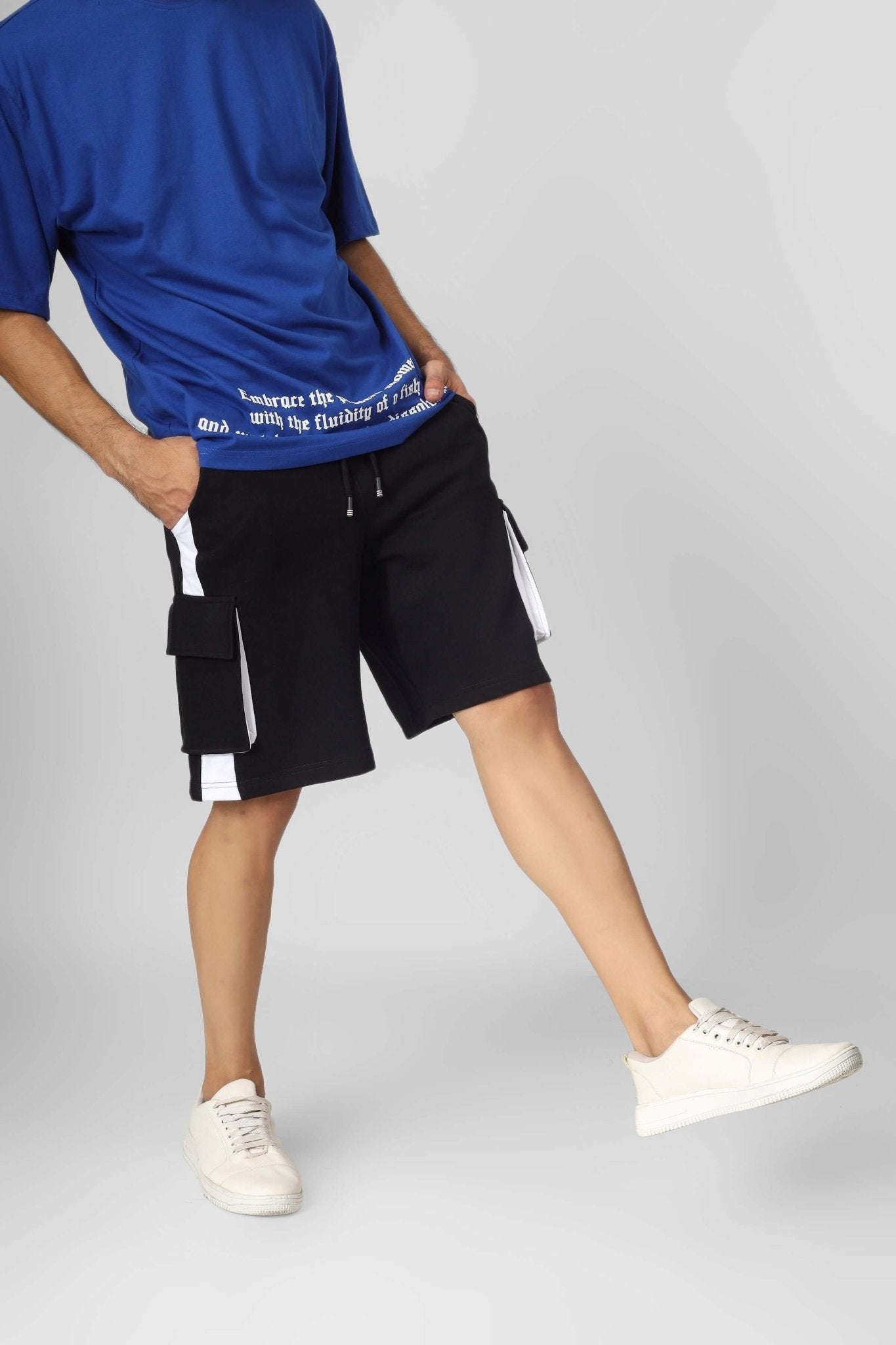 Man wearing CONTRA REGULAR FIT CARGO SHORTS BLACK WHITE in a streetwear style.