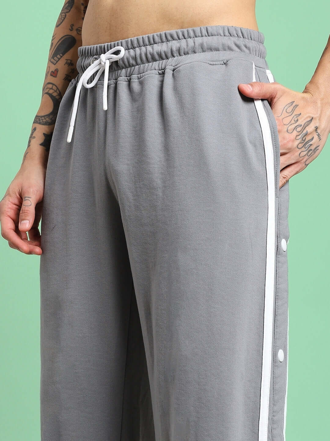 Close-up of CONTRAST PANEL COTTON TERRY JOGGER GREY showing drawstring and side panel details.