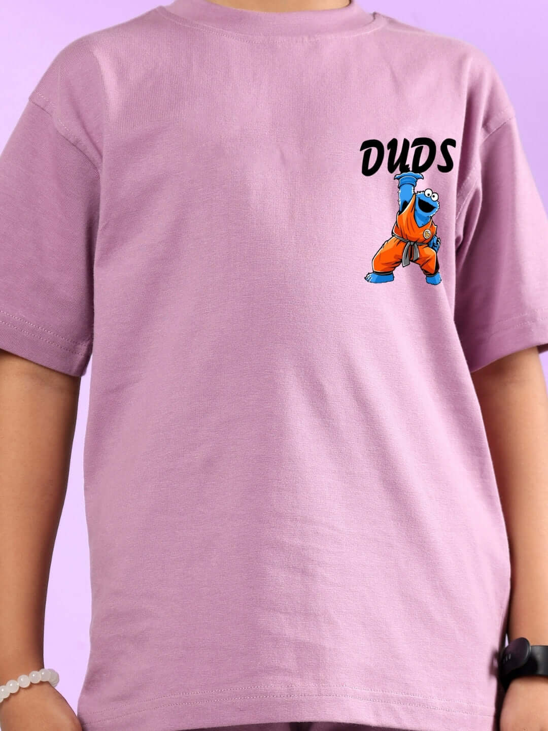 Child wearing COOKIE MONSTER PRINTED CO-ORD FOR BOYS & GIRLS PLUM PURPLE outfit by DUDS.