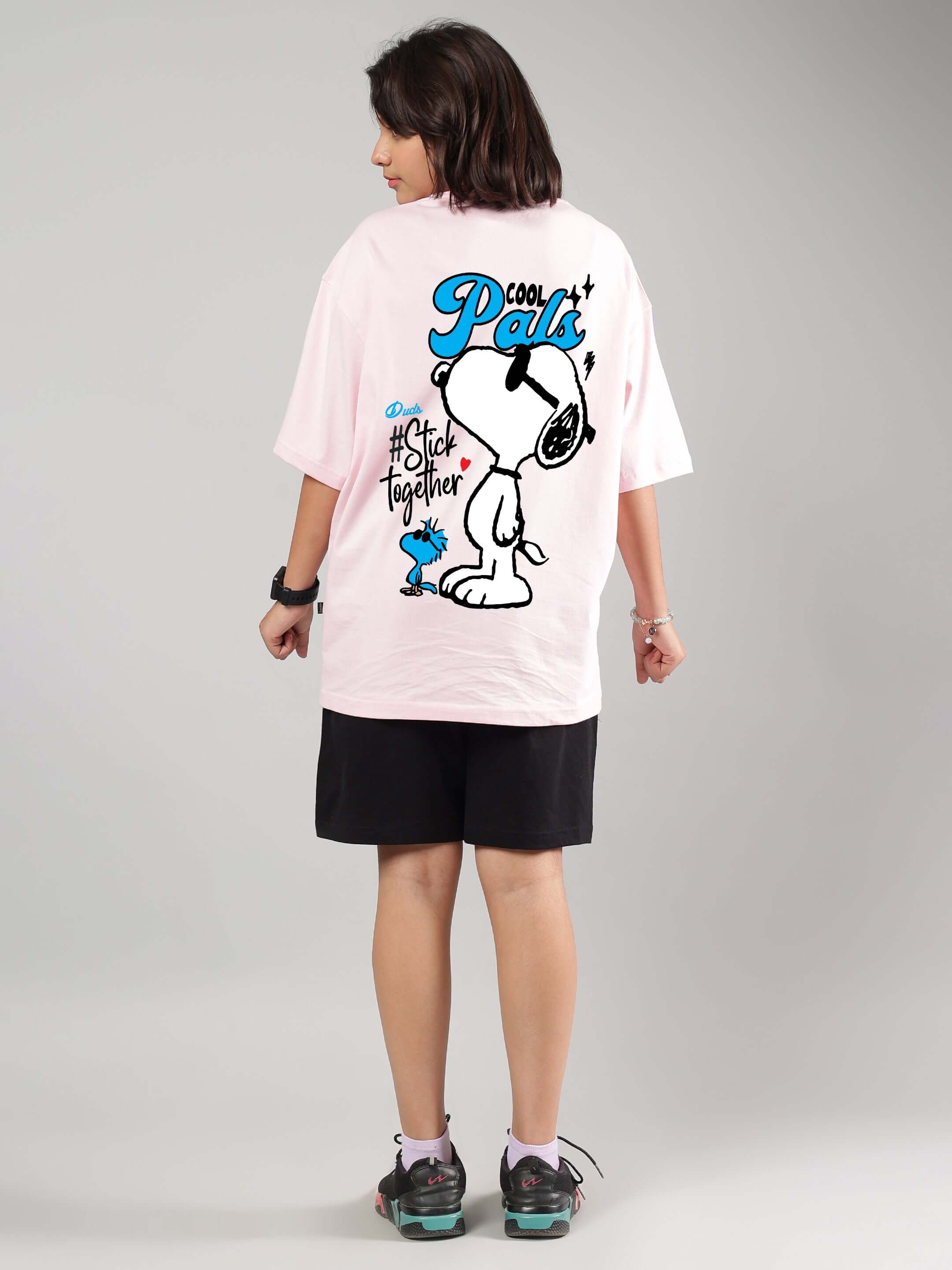 Child wearing COOL PALS CO-ORD FOR BOYS GIRLS PINK-BLACK, showcasing the playful design on a pink shirt paired with black shorts.