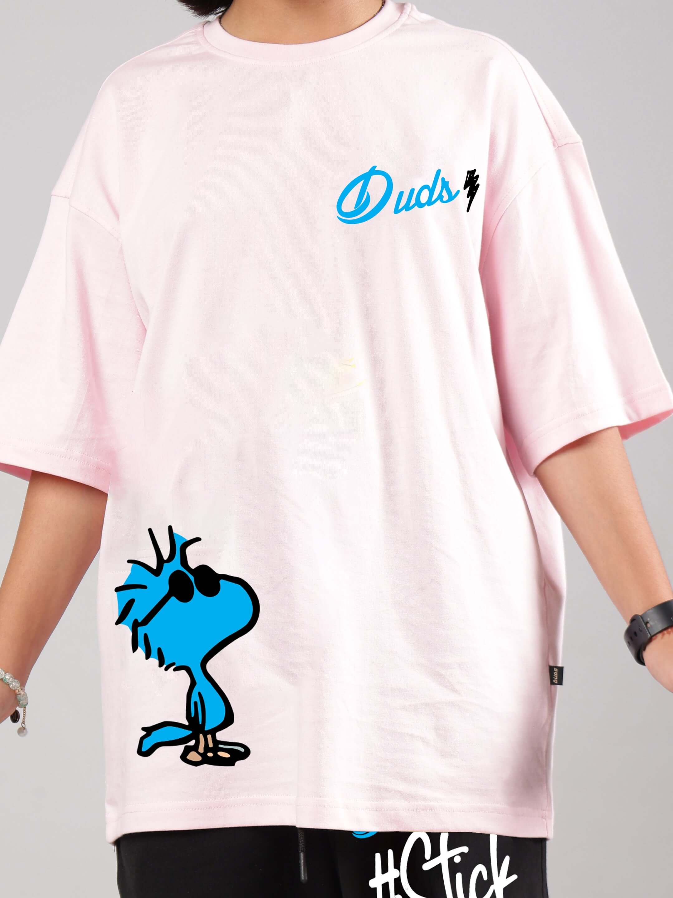 Child wearing COOL PALS CO-ORD FOR BOYS GIRLS PINK-BLACK with playful graphic on pink T-shirt and black pants.