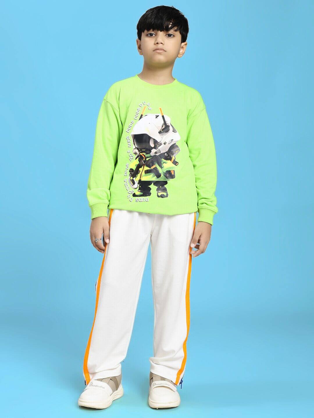 Kid wearing MINI ROBOTICS SWEATSHIRT FOR BOYS AND GIRLS NEON GREEN, standing against blue background, showcasing trendy robotics design.