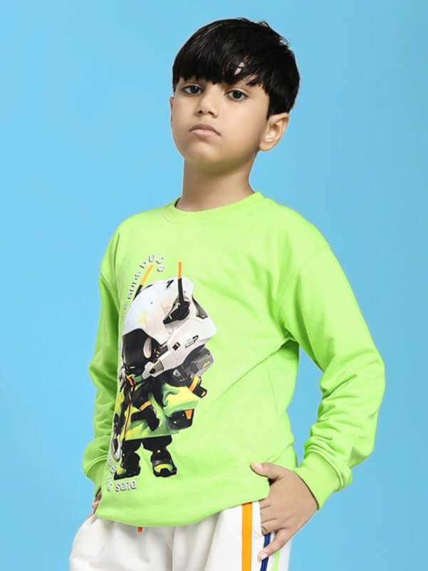 Young boy wearing MINI ROBOTICS SWEATSHIRT FOR BOYS AND GIRLS NEON GREEN with futuristic design, standing confidently against blue background.