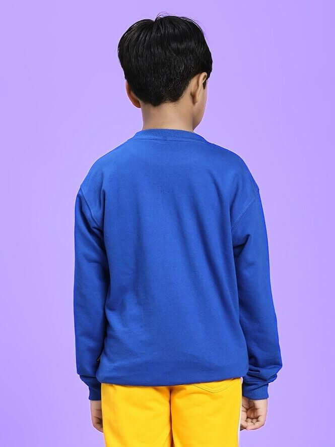 Child wearing COOL PUP SWEATSHIRT FOR BOYS AND GIRLS ROYAL BLUE, showing back view with vibrant color against a purple background.