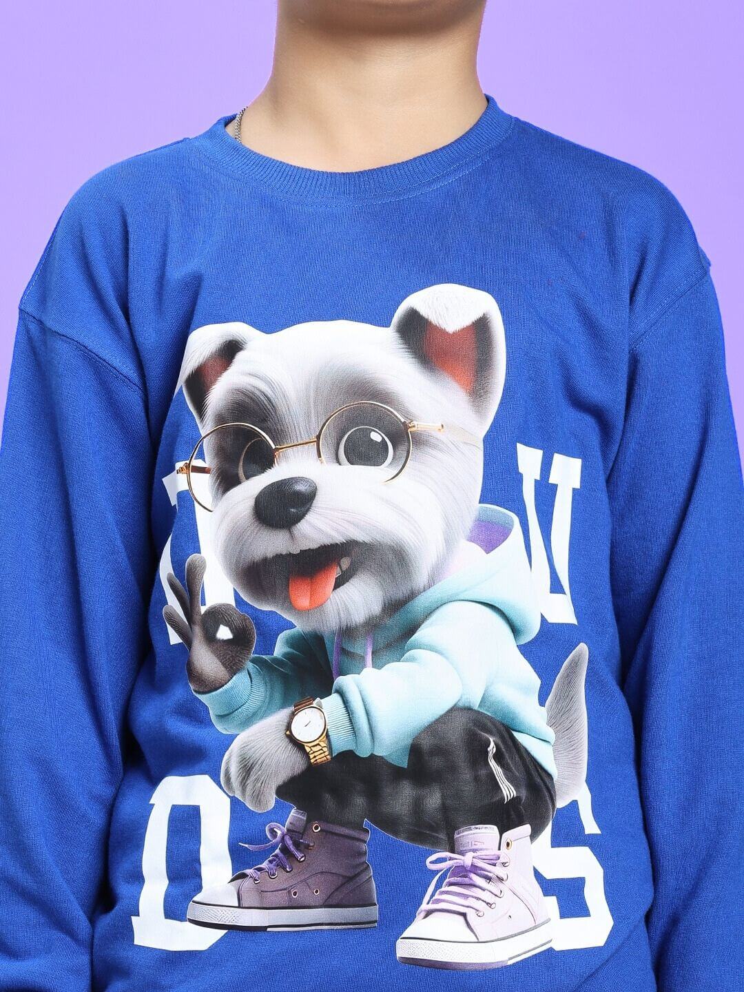 Child wearing a COOL PUP SWEATSHIRT FOR BOYS AND GIRLS ROYAL BLUE with a playful puppy graphic.