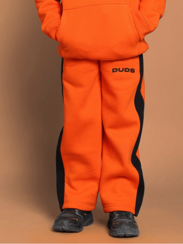 Children's orange fleece pants with black accents, suitable for boys and girls, featuring a cozy fit for outdoor play.