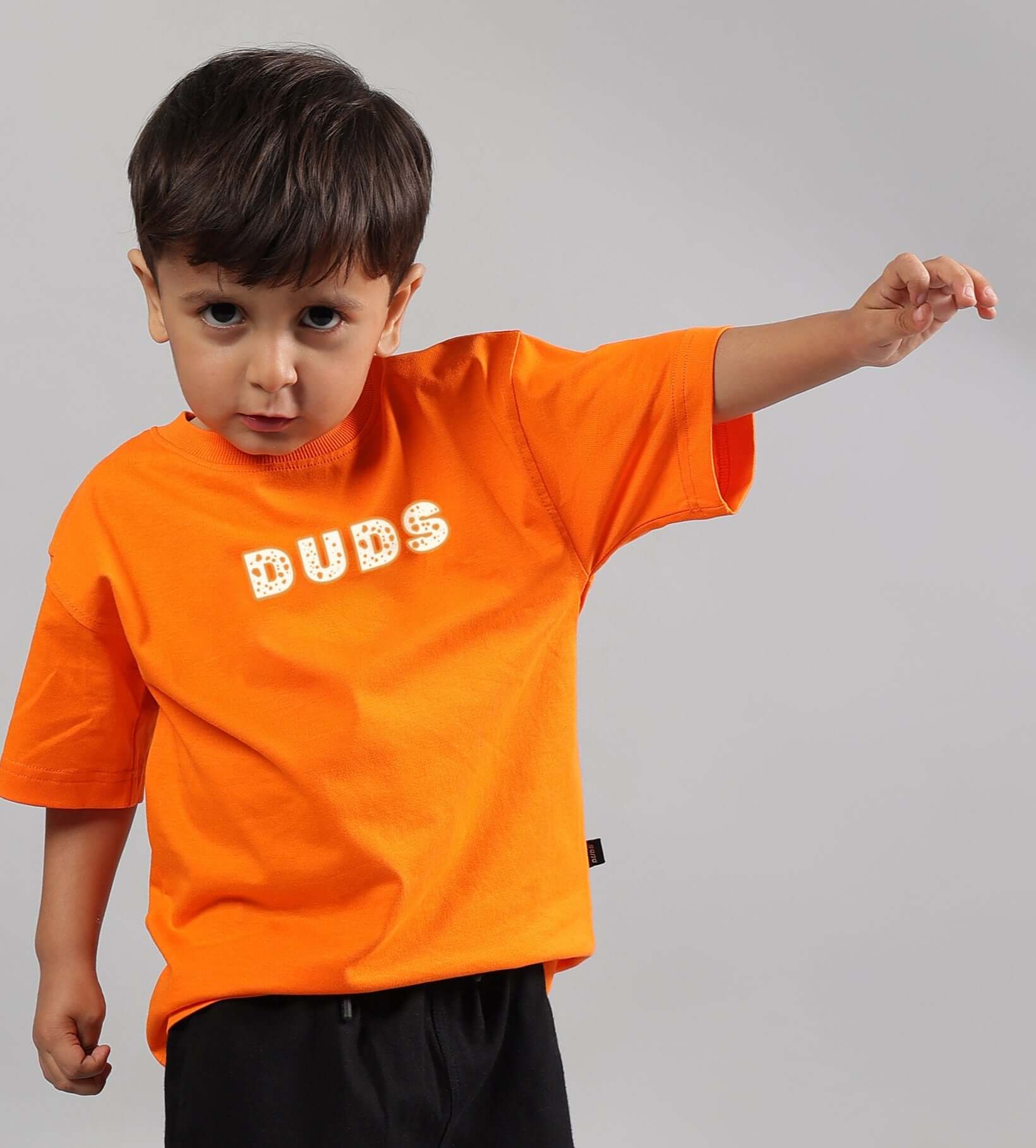 Child wearing orange 'DUDS' Courage Toon T-shirt, available for boys and girls, customizable size option, made to order.