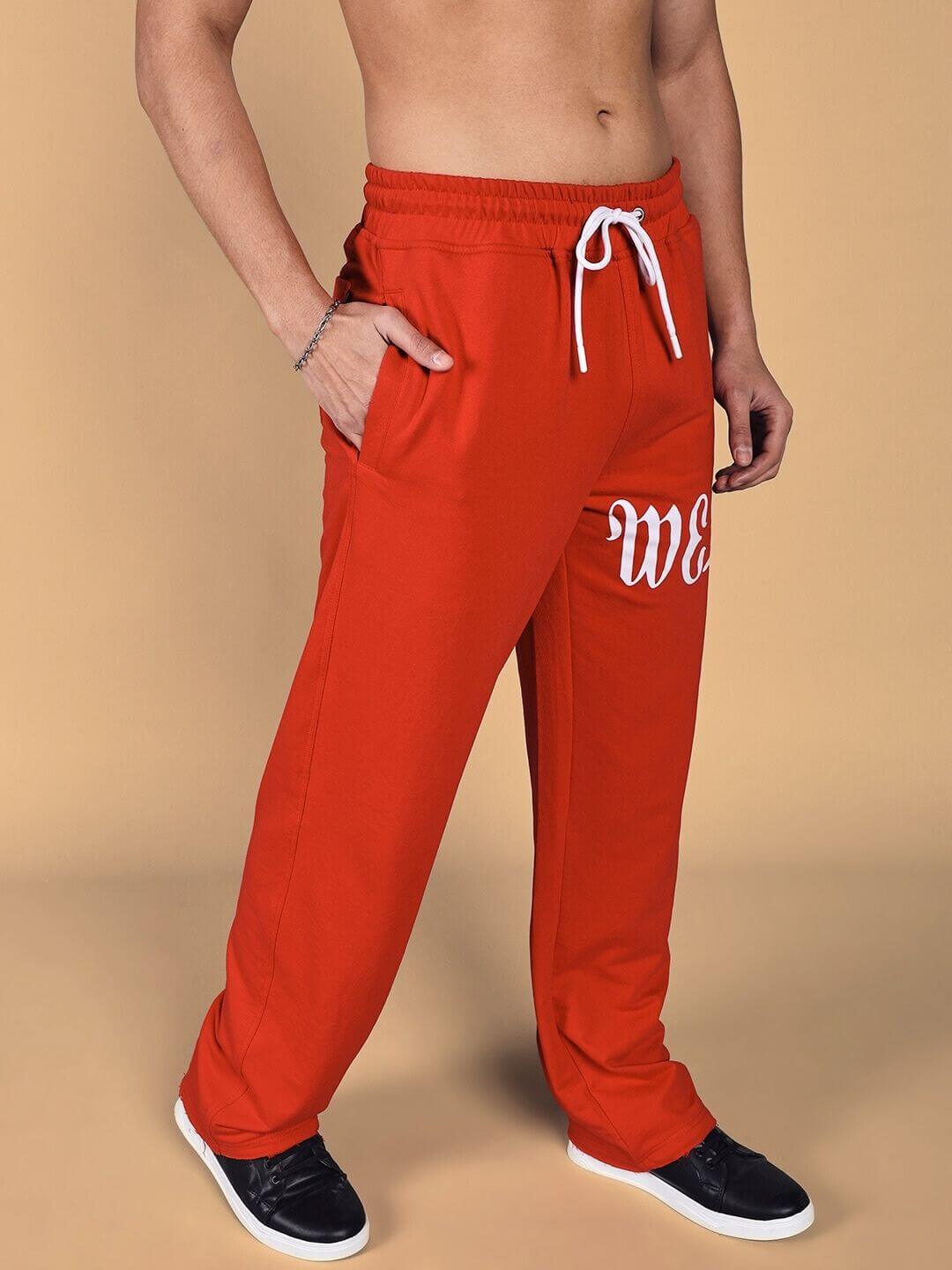 Model wearing Crimson Relaxed Fit Jogger in red, showcasing comfortable design with customizable fit options, by DUDS.