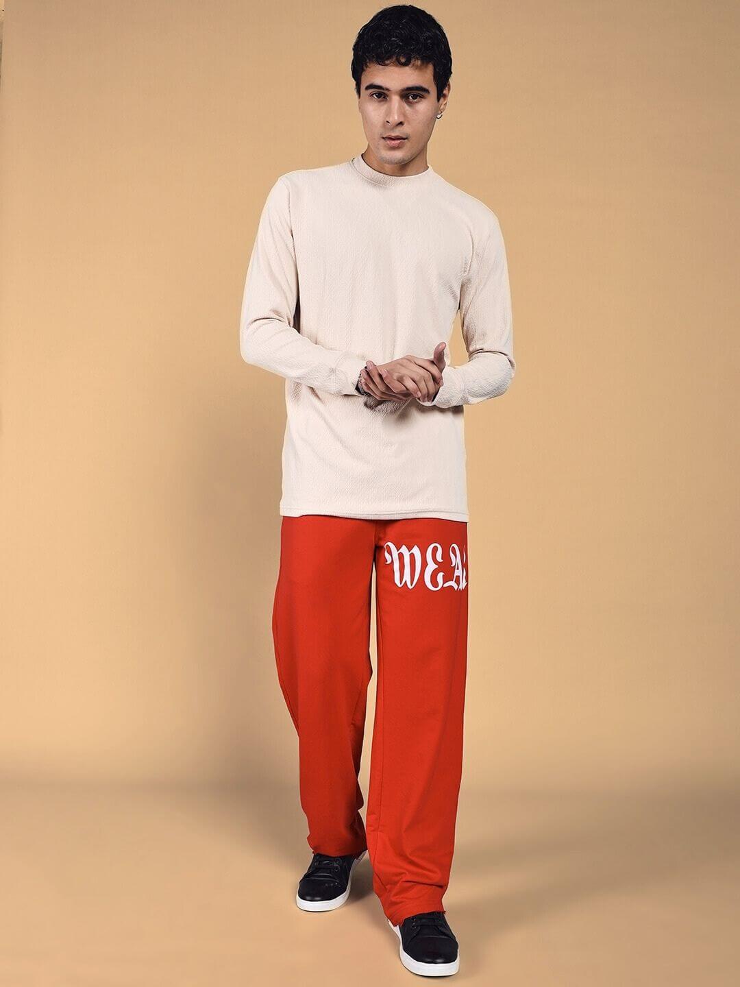 Model wearing Crimson Relaxed Fit Jogger in red, showcasing a casual and comfortable style.