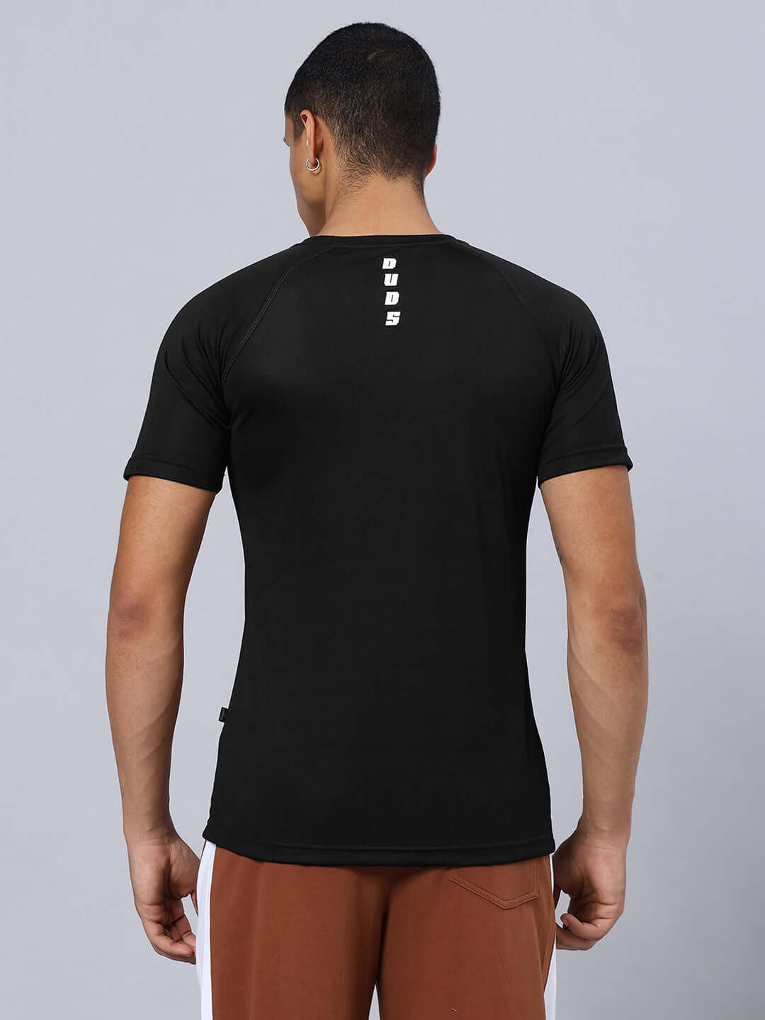 Back view of CRISTINIO REGULAR FIT T-SHIRT BLACK in sports polyester, showcasing short sleeves and design.