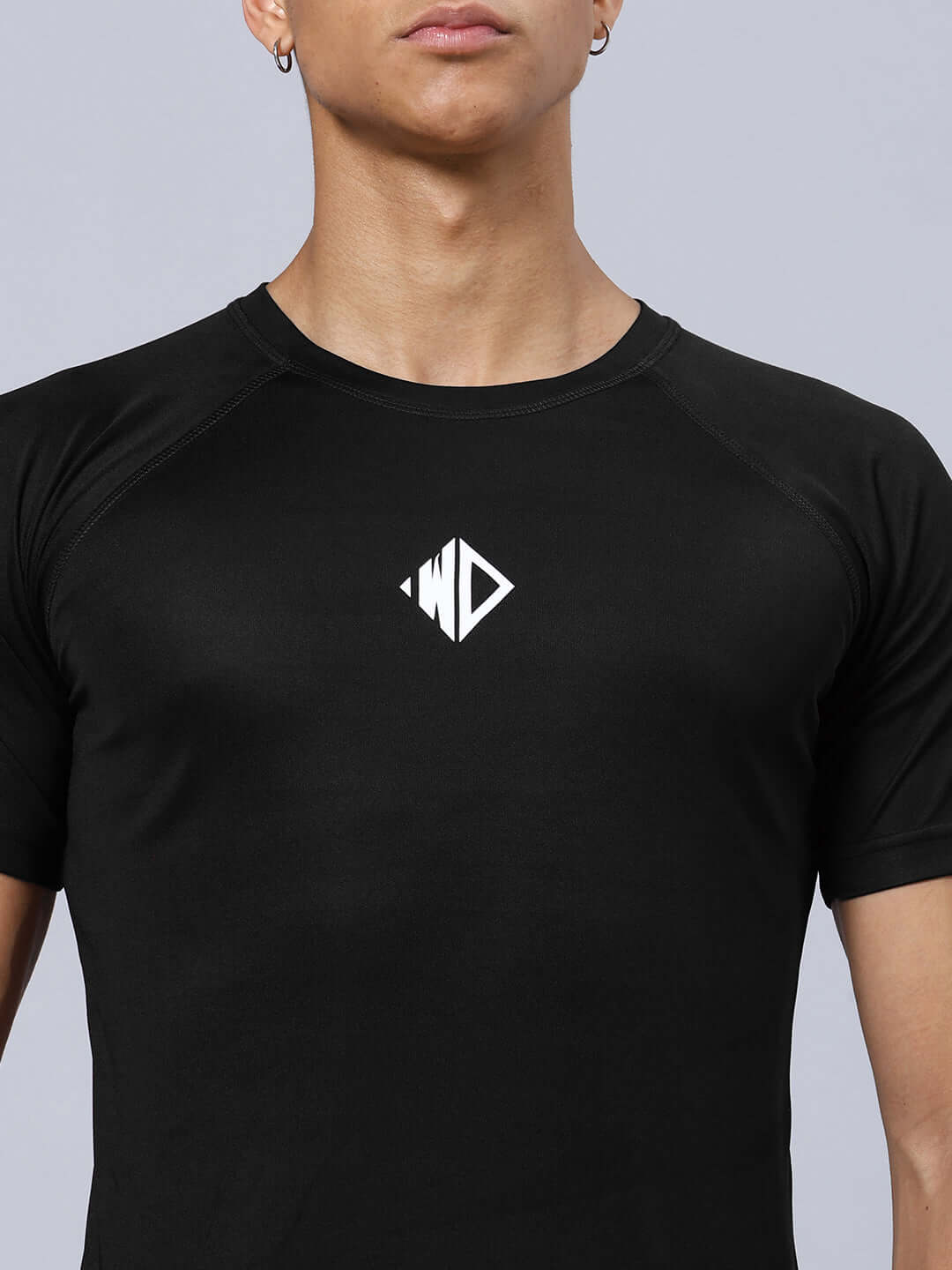 CRISTINIO REGULAR FIT T-SHIRT BLACK made from sports polyester fabric, shown on model, ideal for casual and sporty wear.