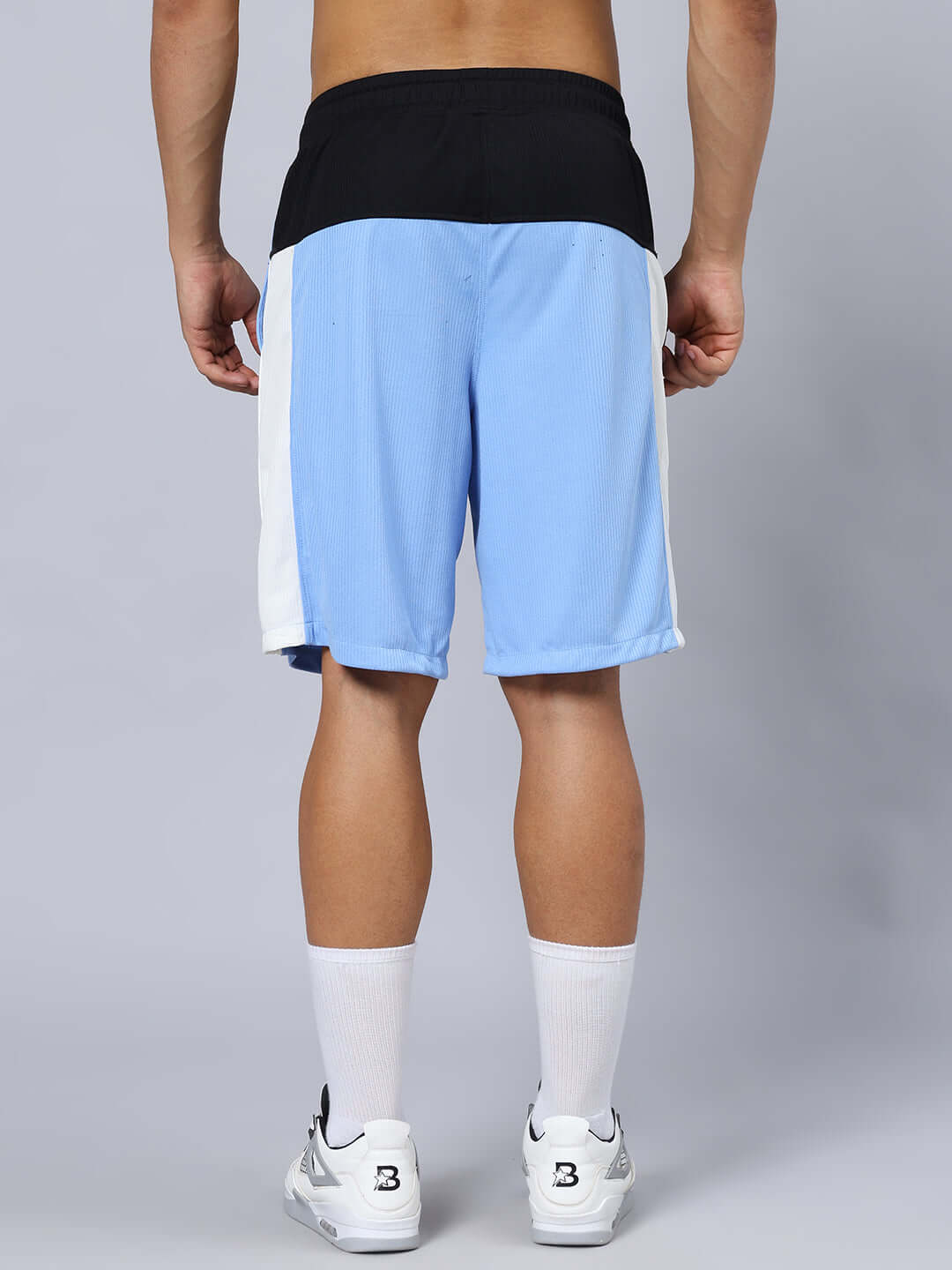 Back view of CRUNCH REGULAR FIT SHORTS BLUE with black waistband and side stripes.